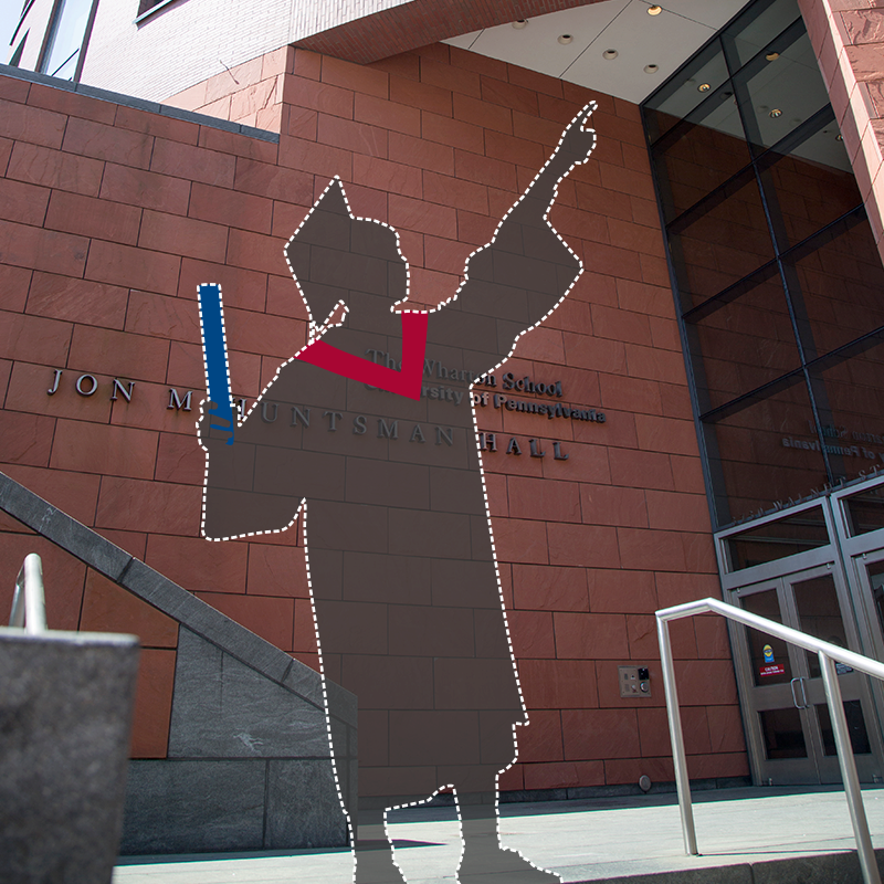 Graduate silhouette outside Huntsman Hall