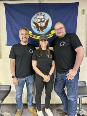 Alexandria Moffitt with her team during the Naval Postgraduate School Joint Interagency Field Experimentation Exercise. From left to right - Joe Taverner (U.S. Special Operations Skillbridge Fellow), Alex Moffitt (Co-Founder & CEO of Clara Copilot), and Tyson Myhres (Co-Founder & CTO of Clara Copilot)
